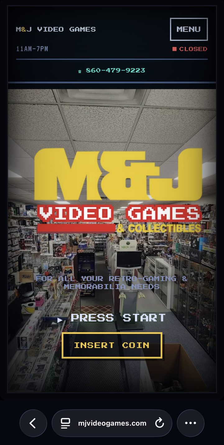 M and J Video Games website shown on a mobile phone